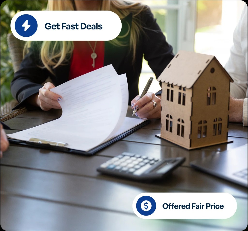 Signing paperwork for a home sale with a fair cash offer